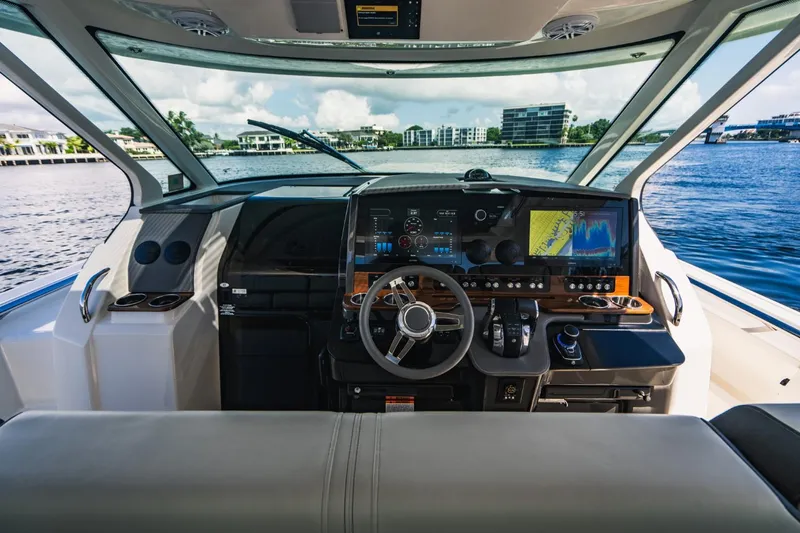 Slide: The Image of 2021 Tiara Sport 43 LS boat helm with advanced navigation system. - 39