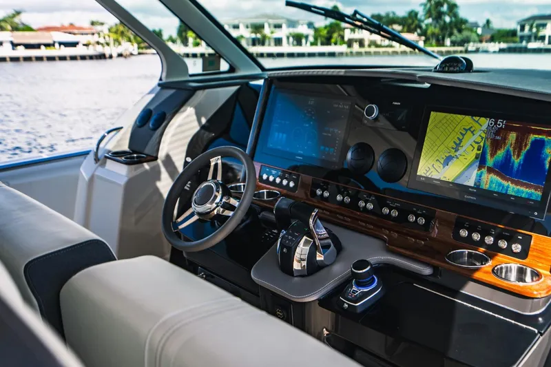 Slide: The Image of 2021 Tiara Sport 43 LS boat helm with advanced navigation system and luxurious interior. - 40