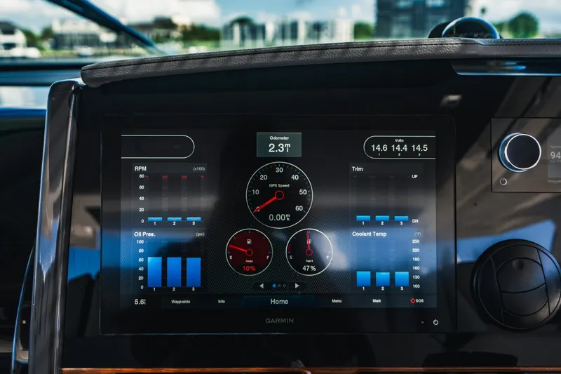 Slide: The Image of Dashboard display of a 2021 Tiara Sport 43 LS boat showing engine metrics. - 41
