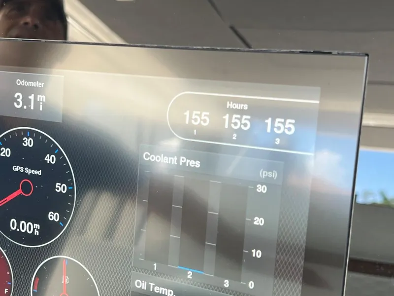 Slide: The Image of Dashboard of a 2021 Tiara Sport 43 LS showing odometer, hours, and coolant pressure. - 43