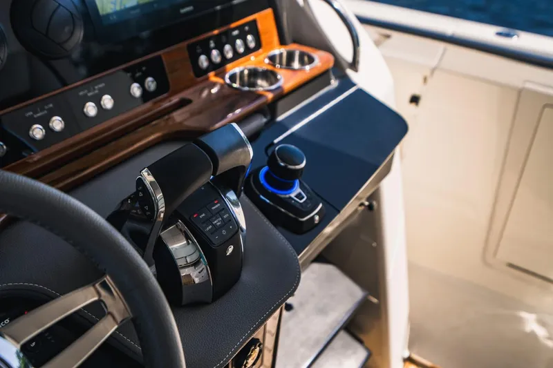 Slide: The Image of 2021 Tiara Sport 43 LS yacht helm with advanced controls and navigation system. - 45