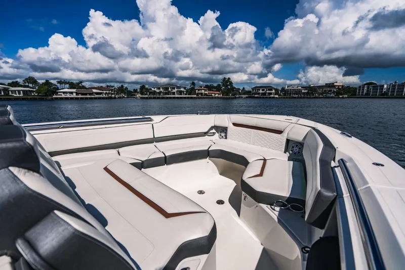 Slide: The Image of 2021 Tiara Sport 43 LS boat with spacious seating on a sunny day. - 47