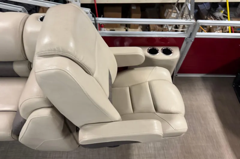 Slide: The Image of 2024 Sun Tracker Party Barge 22 XP3 beige seating with cup holders and armrests. - 14