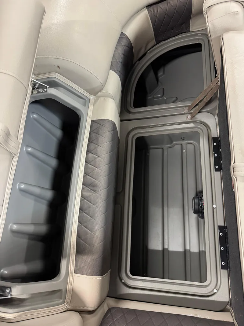 Slide: The Image of 2024 Sun Tracker Party Barge 22 XP3 storage compartments with cushioned seating. - 9