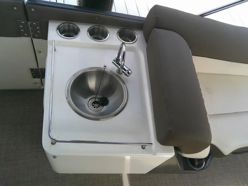 Slide: The Image of 2022 Bayliner Element XR7 boat sink and cup holders. - 10