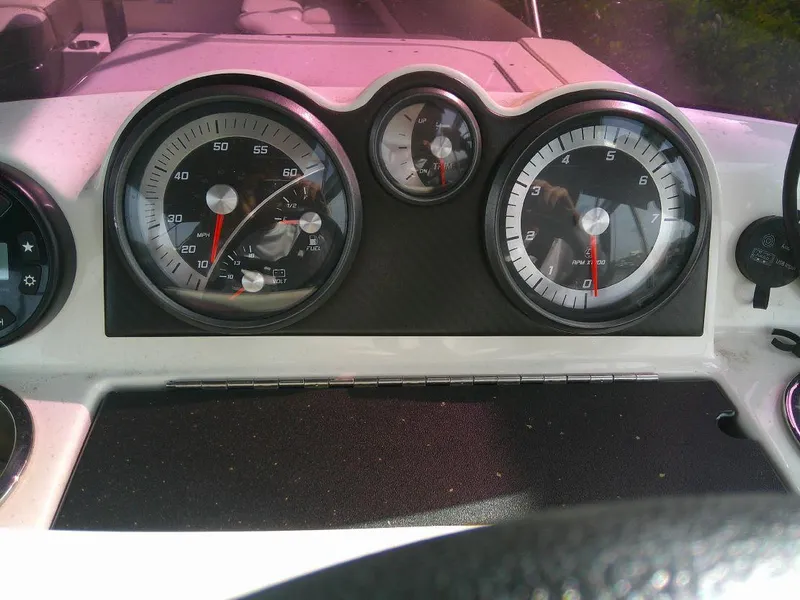 Slide: The Image of Dashboard of a 2022 Bayliner Element XR7 boat with speedometer and gauges. - 13