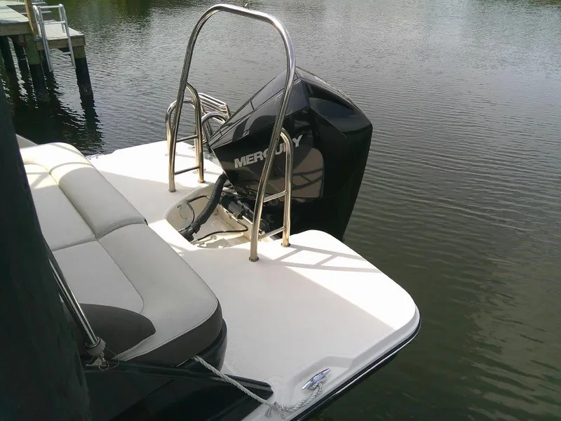 Slide: The Image of 2022 Bayliner Element XR7 boat with Mercury outboard motor on calm water. - 4