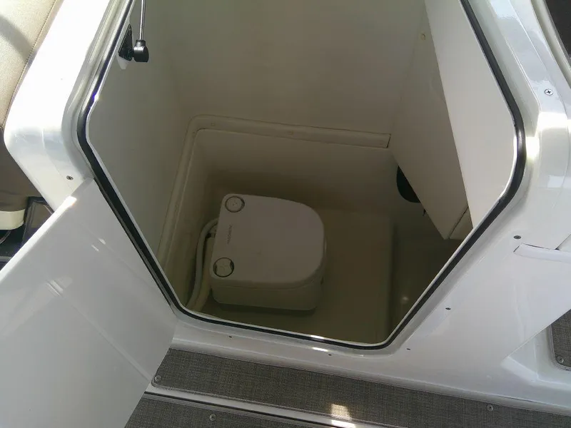 Slide: The Image of 2022 Bayliner Element XR7 boat interior with compact toilet. - 9