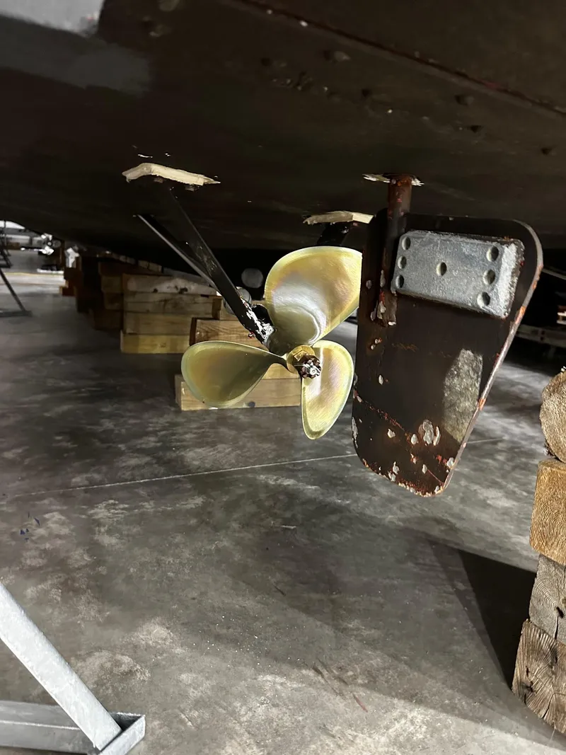 Slide: The Image of Propeller and rudder of a 1975 Marinette 32' Cruiser on dry dock. - 10