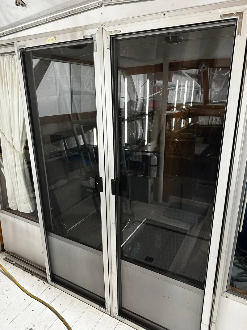 Slide: The Image of Sliding glass doors on a 1975 Marinette 32' Cruiser boat interior. - 14