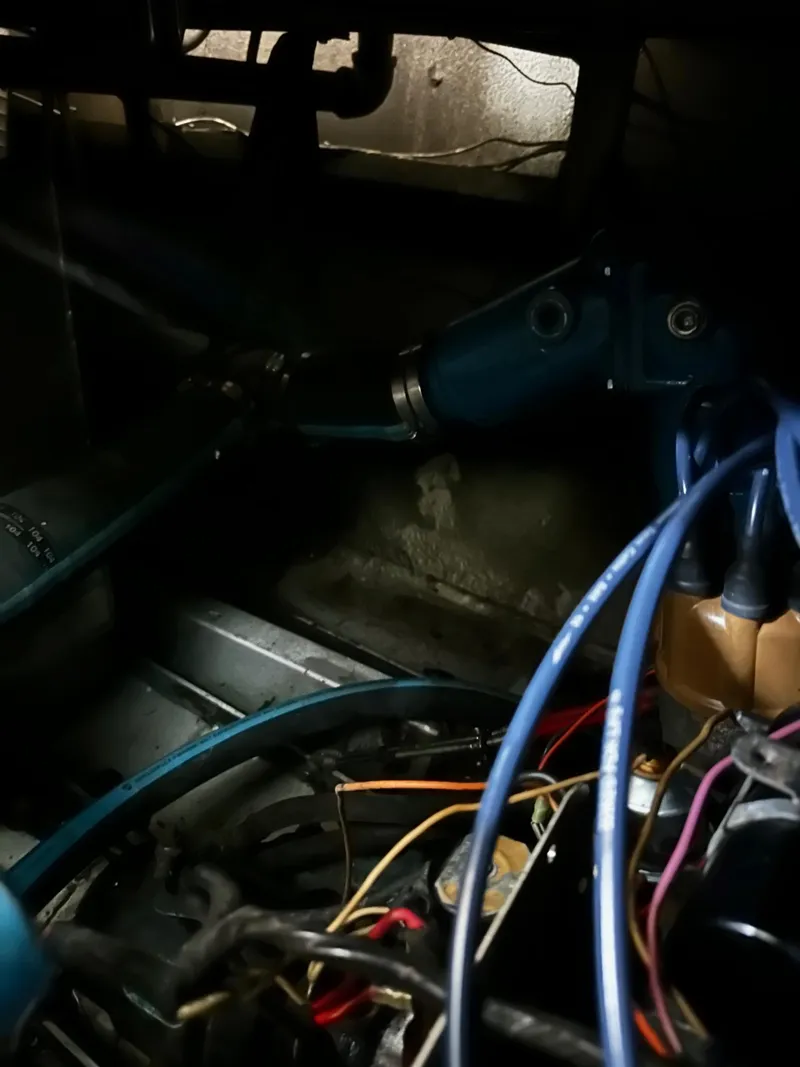 Slide: The Image of Engine compartment of a 1975 Marinette 32' Cruiser with visible wiring and components. - 21