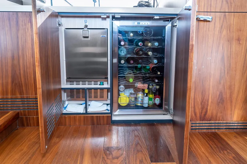 Slide: The Image of 2017 Sunseeker Manhattan 52 yacht interior with built-in fridge and ice maker. - 16