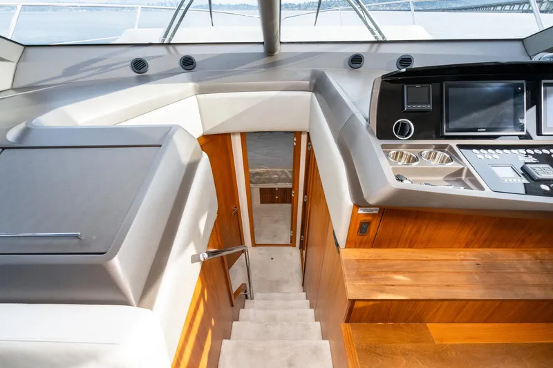 Slide: The Image of Interior of 2017 Sunseeker Manhattan 52 yacht with modern helm and wooden stairs. - 24