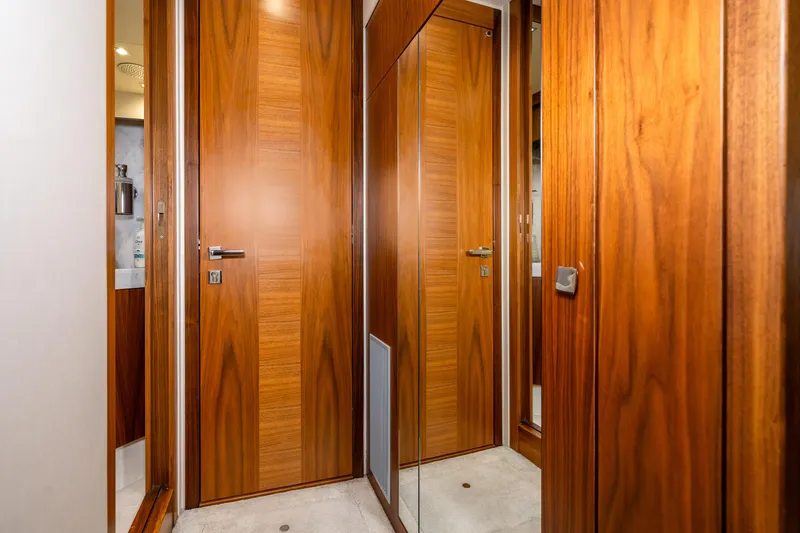 Slide: The Image of Luxurious wooden interior of 2017 Sunseeker Manhattan 52 yacht with mirrored door. - 31
