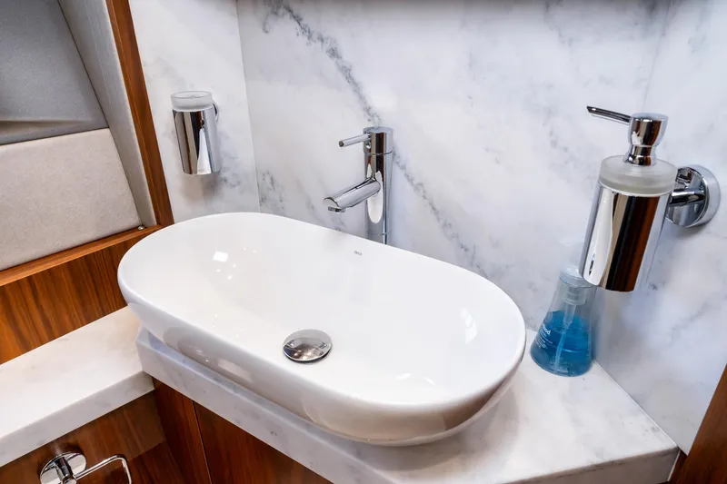 Slide: The Image of Modern bathroom sink in 2017 Sunseeker Manhattan 52 yacht with marble countertop. - 38