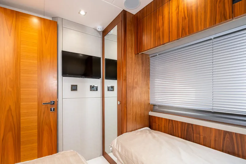 Slide: The Image of Interior cabin of 2017 Sunseeker Manhattan 52 yacht with twin beds and wooden finishes. - 43