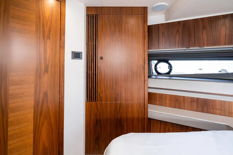Slide: The Image of Interior cabin of 2017 Sunseeker Manhattan 52 yacht with wooden paneling and window. - 48