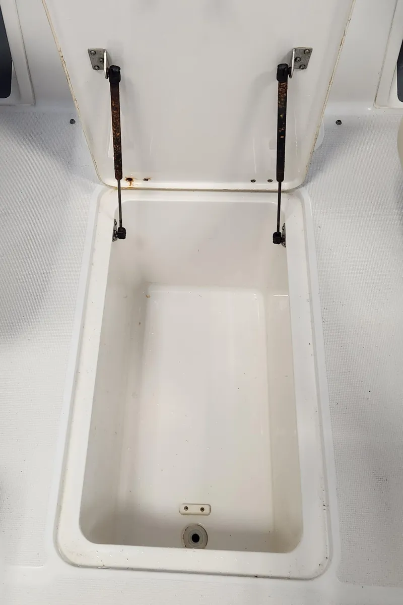 Slide: The Image of Storage compartment of a 2004 Chris-Craft Corsair 25 boat. - 16