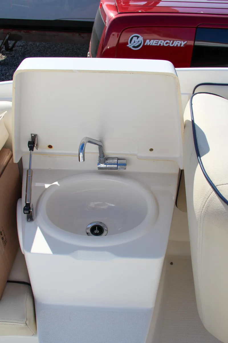 Slide: The Image of 2004 Chris-Craft Corsair 25 boat sink and faucet setup. - 41