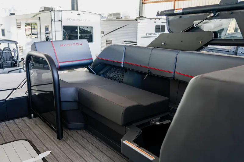 Slide: The Image of 2023 Manitou 22 Explore Bench interior with modern seating and sleek design. - 6