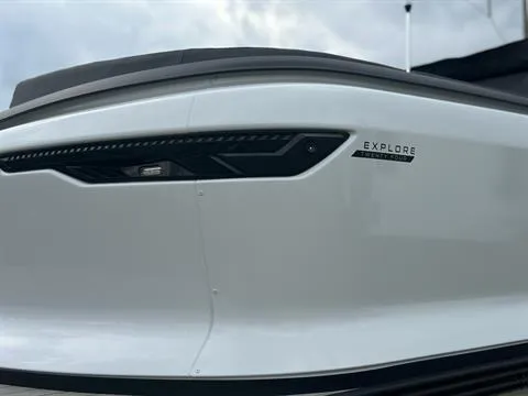 Slide: The Image of 2024 Manitou 24 Explore boat, sleek white exterior with modern design. - 5