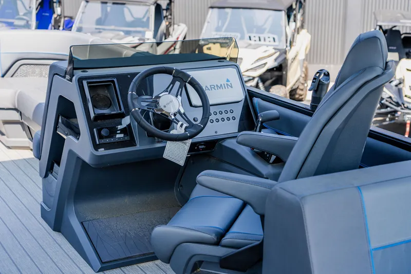 Slide: The Image of 2023 Manitou 24 EXPLORE SWITCHBACK boat cockpit with Garmin navigation system. - 3