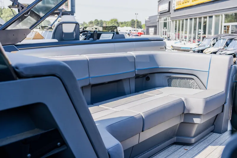 Slide: The Image of 2023 Manitou 24 EXPLORE SWITCHBACK boat interior with spacious seating. - 7