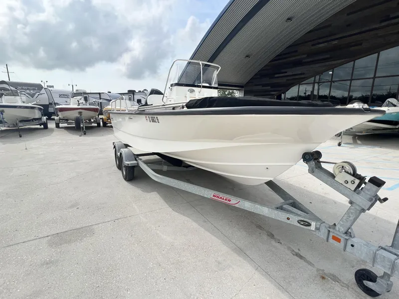 Slide: The Image of 2018 Boston Whaler 190 Montauk boat on a trailer at a dealership. - 3