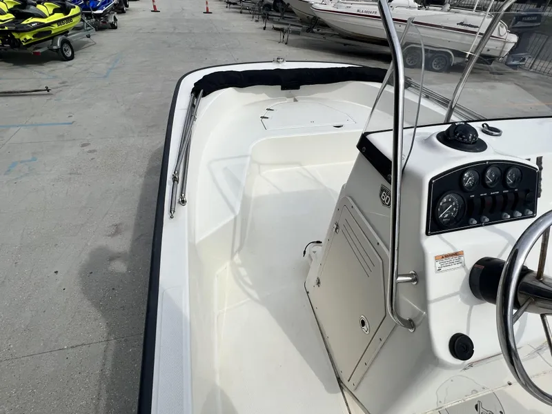 Slide: The Image of 2018 Boston Whaler 190 Montauk boat interior with console and steering wheel. - 4