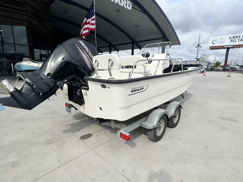 Slide: The Image of 2018 Boston Whaler 190 Montauk boat on trailer with Mercury outboard motor. - 7