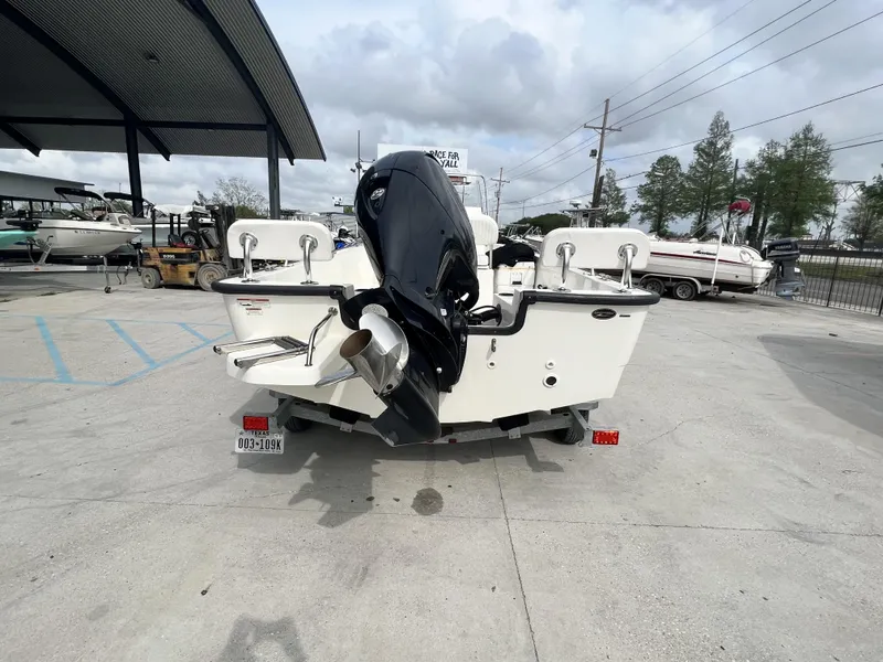 Slide: The Image of 2018 Boston Whaler 190 Montauk boat with outboard motor in a marina. - 8