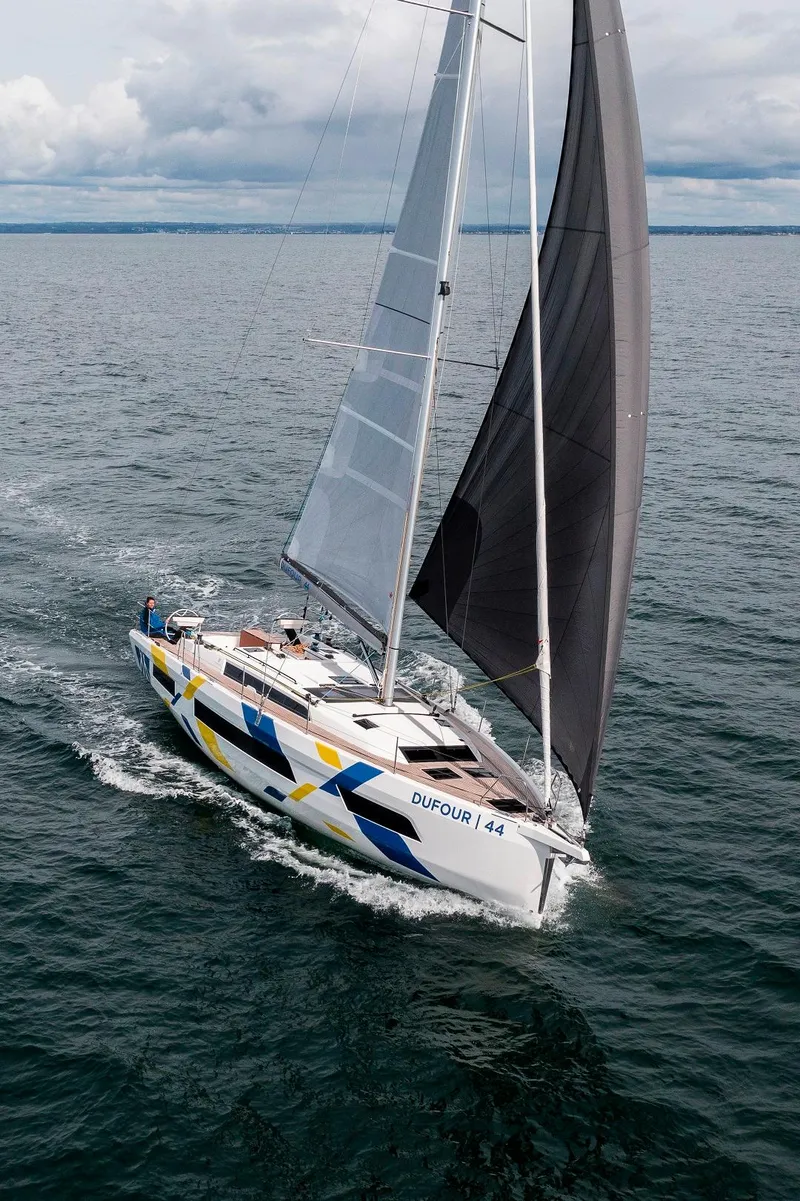 Slide: The Image of Dufour 44 sailboat cruising on open water. - 20