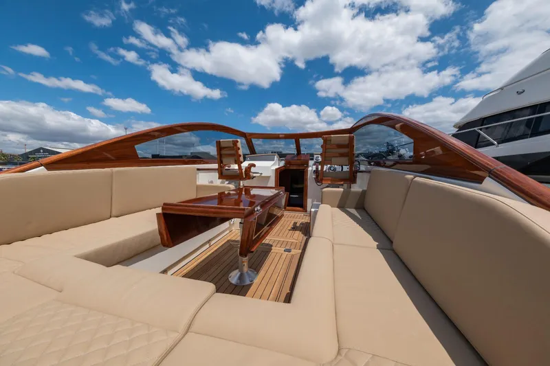 Slide: The Image of Vento V40 Retro Classic Open 2023 yacht interior with beige seating and wooden accents. - 10
