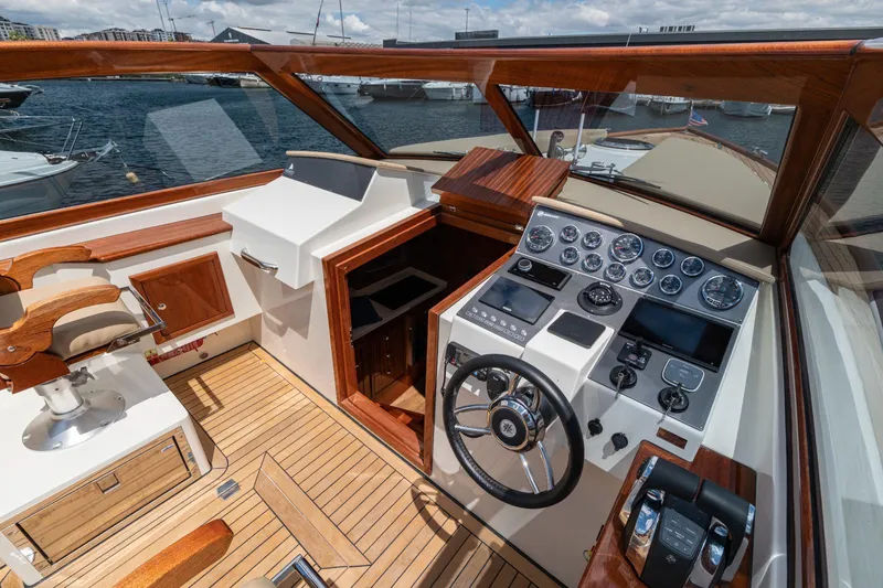 Slide: The Image of Cockpit of 2023 Vento V40 Retro Classic Open yacht with wooden accents and modern controls. - 12