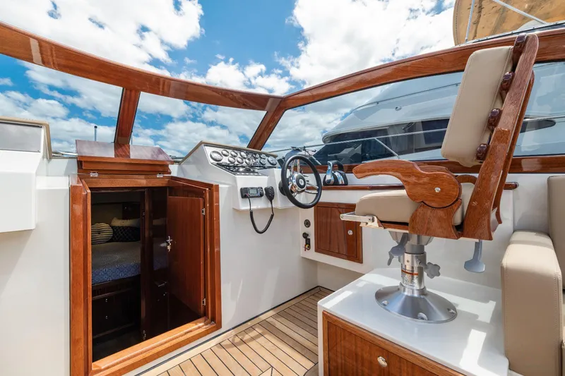 Slide: The Image of Vento V40 Retro Classic Open 2023 boat interior with wooden accents and steering wheel. - 14
