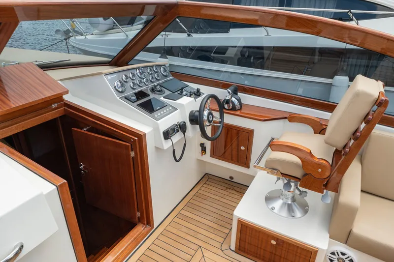 Slide: The Image of 2023 Vento V40 Retro Classic Open boat cockpit with wooden accents and modern controls. - 15