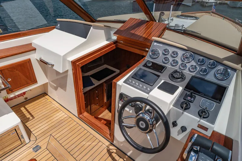 Slide: The Image of Cockpit of 2023 Vento V40 Retro Classic Open boat with wooden accents and modern controls. - 16
