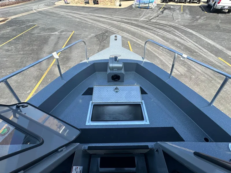 Slide: The Image of 2024 Spartan 260 Maximus Pro XL boat deck with storage compartment. - 16