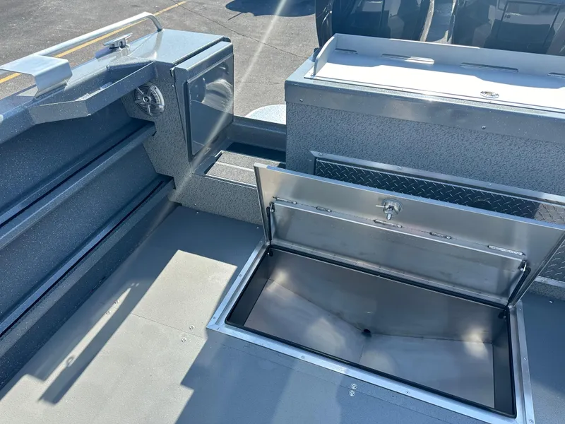 Slide: The Image of 2024 Spartan 260 Maximus Pro XL boat with open storage compartment. - 24
