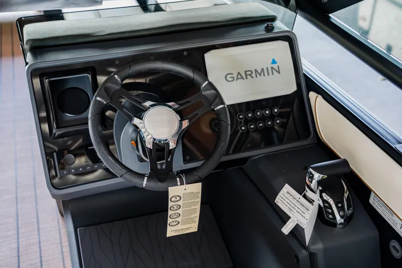 Slide: The Image of 2024 Manitou 26 Explore SHP575 Switchback boat dashboard with Garmin navigation system. - 9