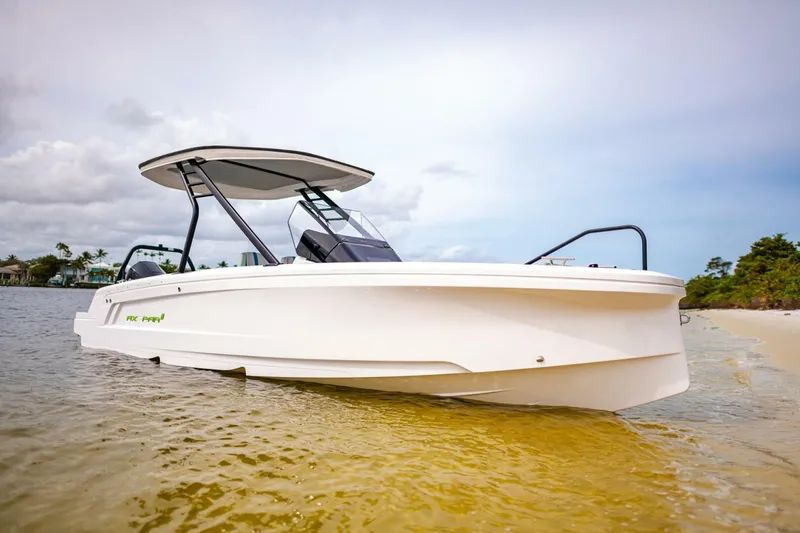 The Image of 2022 Axopar 22 Spyder x Jobe Revolve boat on a sandy beach. - 1