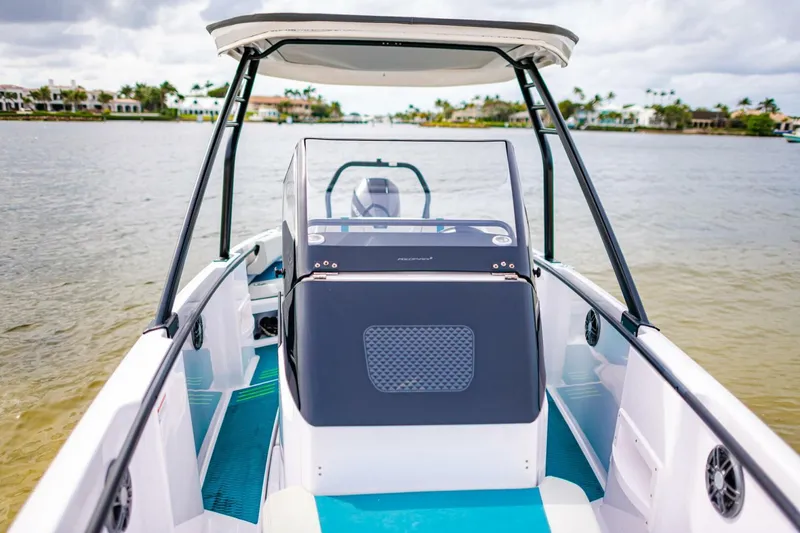 Slide: The Image of 2022 Axopar 22 Spyder x Jobe Revolve boat on calm water. - 11