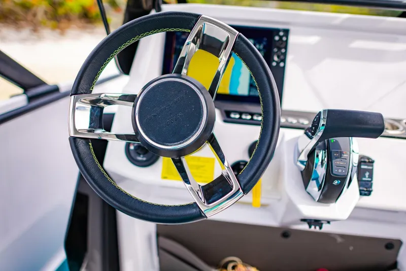 Slide: The Image of 2022 Axopar 22 Spyder x Jobe Revolve steering wheel and control panel. - 13
