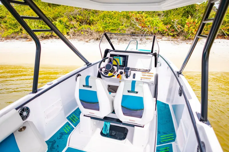 Slide: The Image of 2022 Axopar 22 Spyder x Jobe Revolve boat interior with dual seats and modern dashboard. - 16