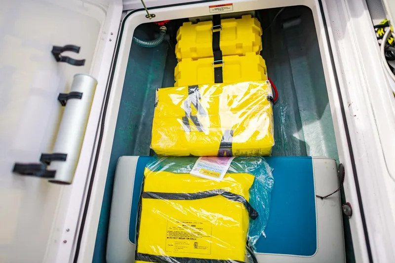 Slide: The Image of Storage compartment of 2022 Axopar 22 Spyder x Jobe Revolve with safety gear. - 20