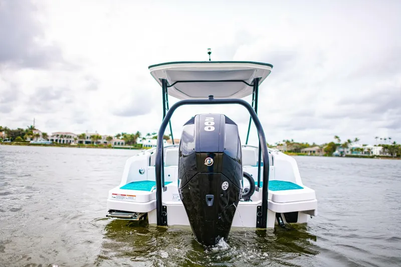 Slide: The Image of 2022 Axopar 22 Spyder x Jobe Revolve boat on water, rear view. - 21