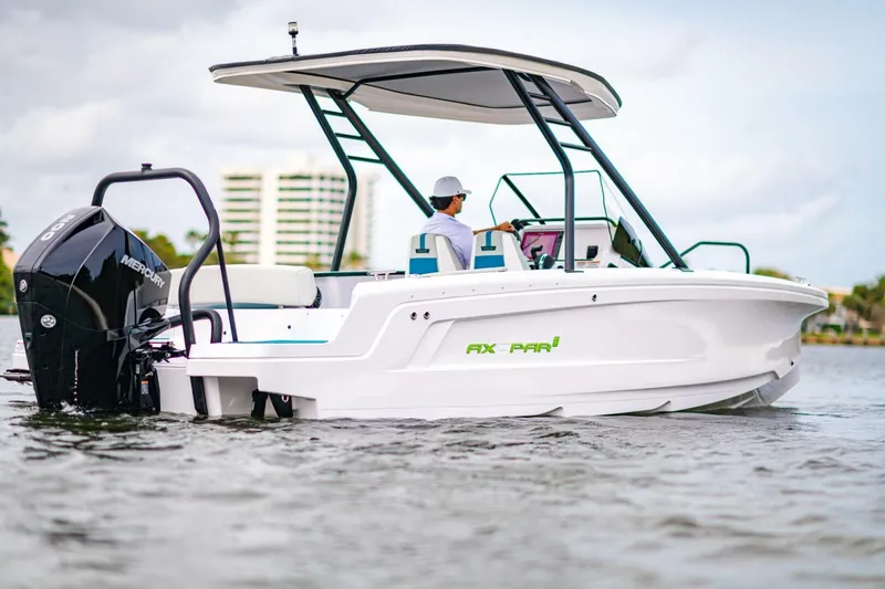 Slide: The Image of 2022 Axopar 22 Spyder x Jobe Revolve boat on water, side view. - 5