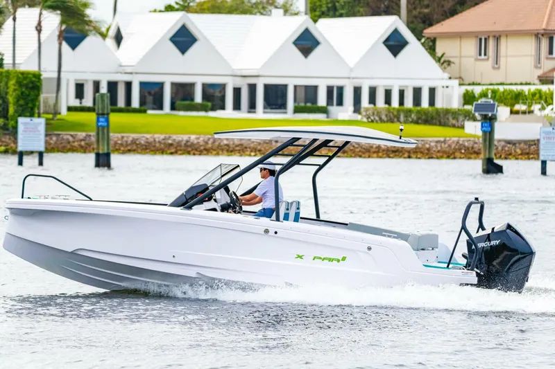 Slide: The Image of 2022 Axopar 22 Spyder x Jobe Revolve boat cruising on water. - 6