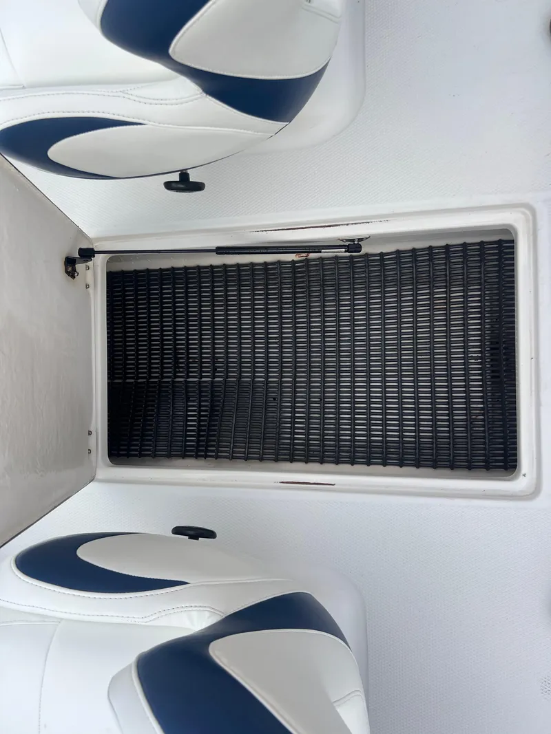 Slide: The Image of Interior seating and storage area of a 2013 Chaparral 19 Sport H2O boat. - 16