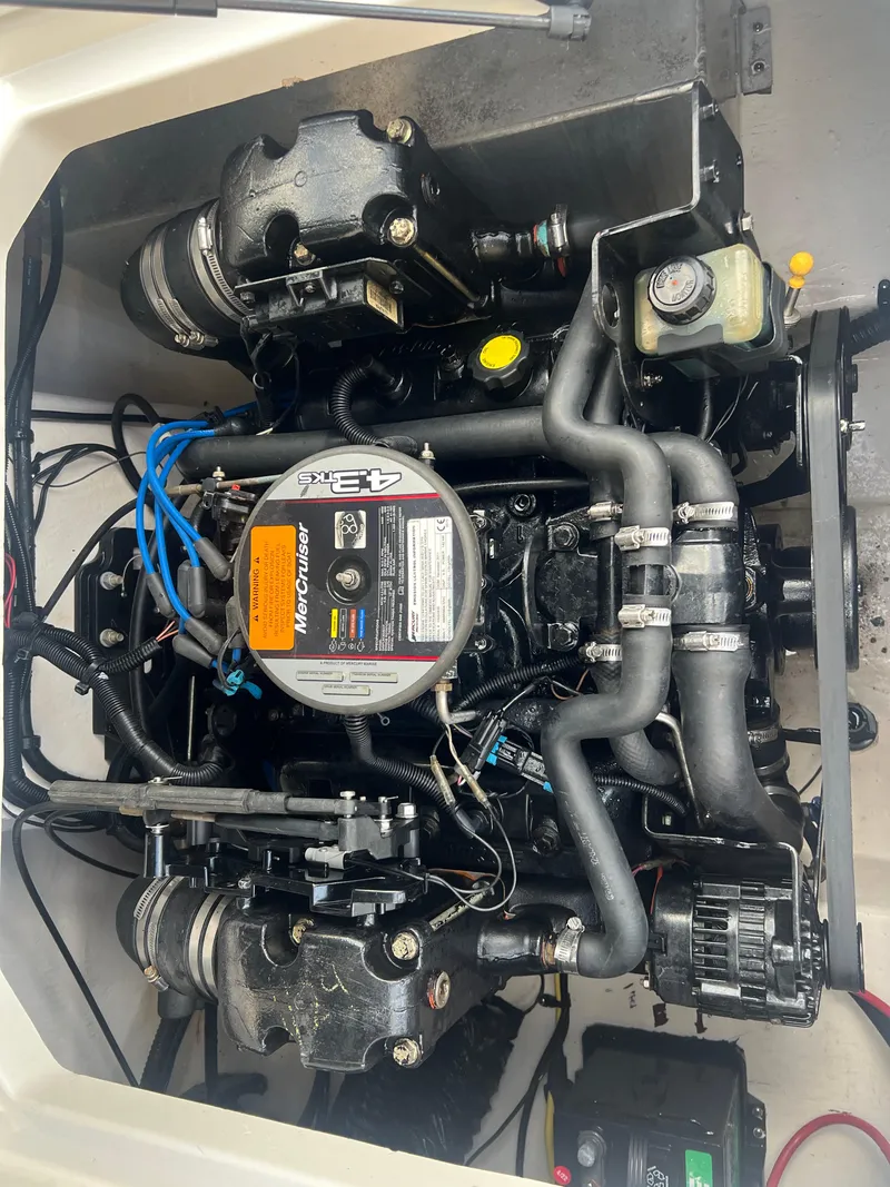 Slide: The Image of Engine compartment of a 2013 Chaparral 19 Sport H2O boat. - 17